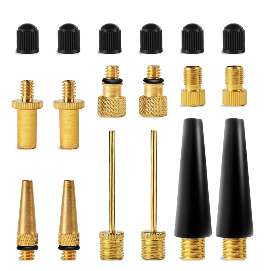 Set of brass and black air pump valve adapters and inflation needles
